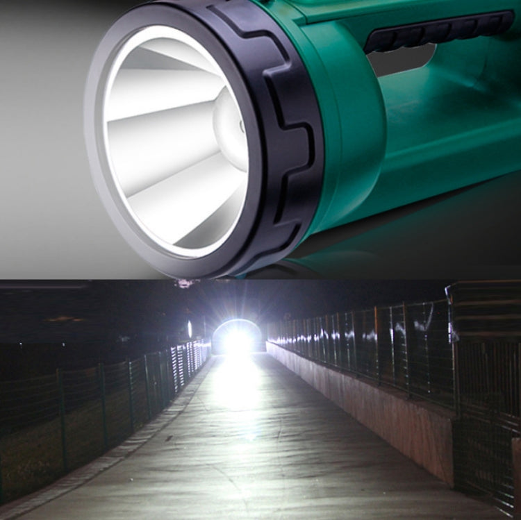 Long-shot LED flashlight with bright beam shining from teal-and-black body