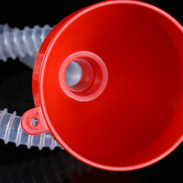 Red funnel top with center opening and attached clear ribbed hose end