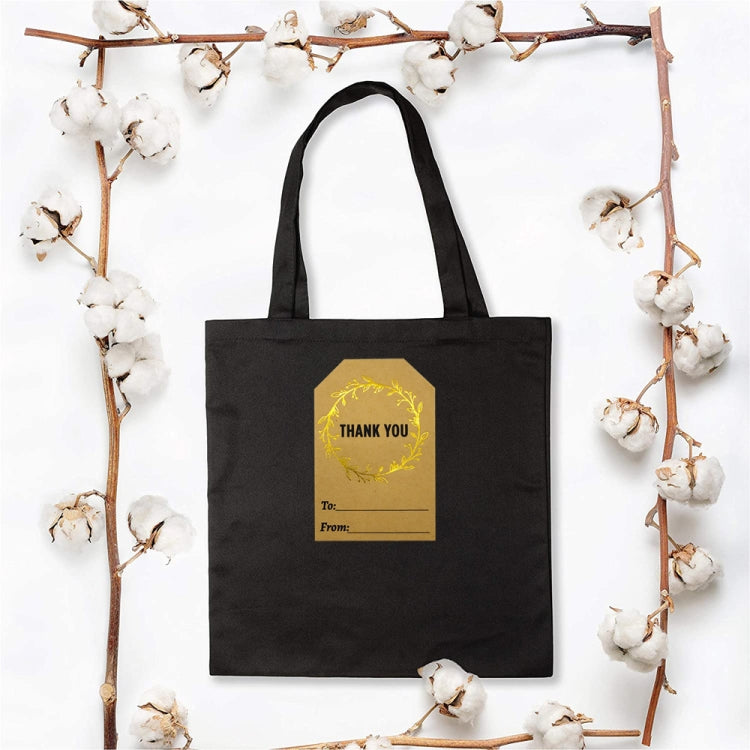Black tote bag with Kraft thank you sticker label in gold wreath, To/From