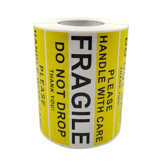 Roll of fragile warning stickers with yellow and black “FRAGILE” and “HANDLE WITH CARE”