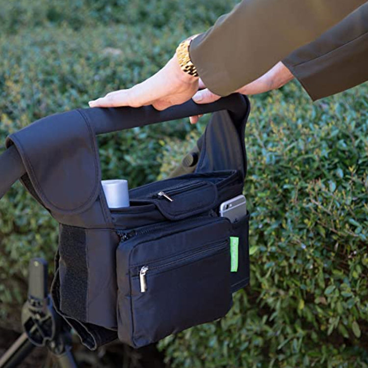 Black stroller storage bag with front zip pocket and side mesh holder as hand loads items