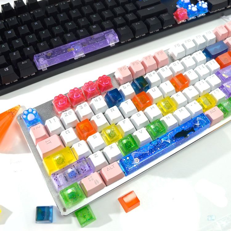Clear silicone keycap mold tray with colorful square keycaps and lettering