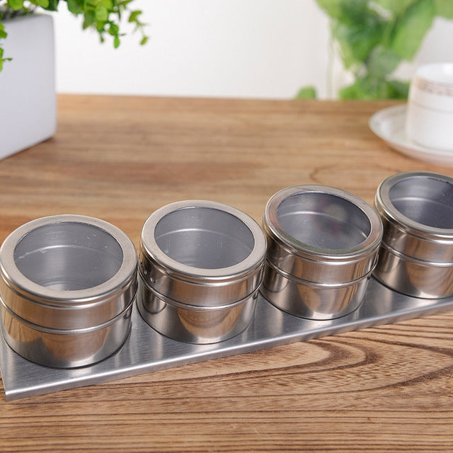Stainless steel magnetic seasoning cruet set with four canisters on metal base