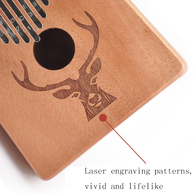 Wooden deer-head kalimba with engraved patterns and circular thumb tone hole
