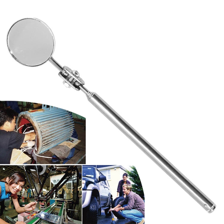 Telescopic inspection mirror with round silver head and extended metal handle