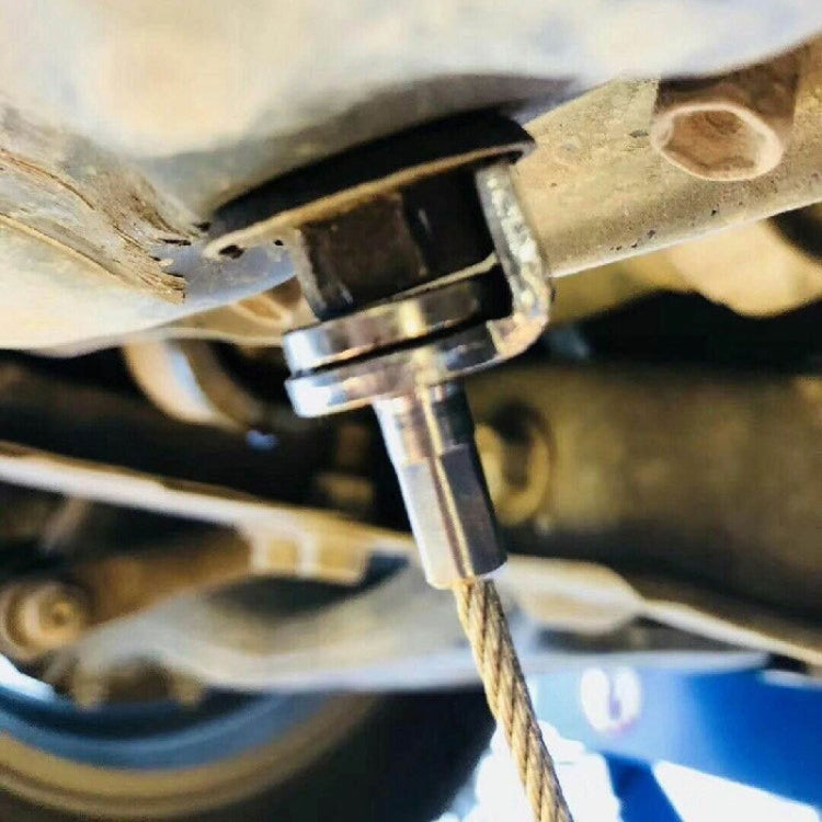 Magnetic suction wrench used under vehicle near metal part, cable extended