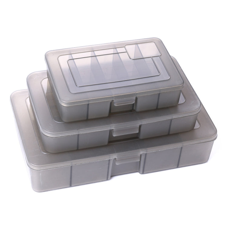 Stacked fishing tackle storage boxes with clear window lids and compartment dividers