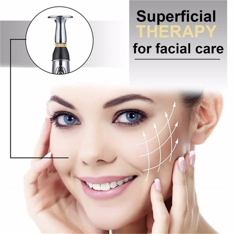 Electronic acupuncture pen near a face for superficial therapy, shown with facial treatment markers