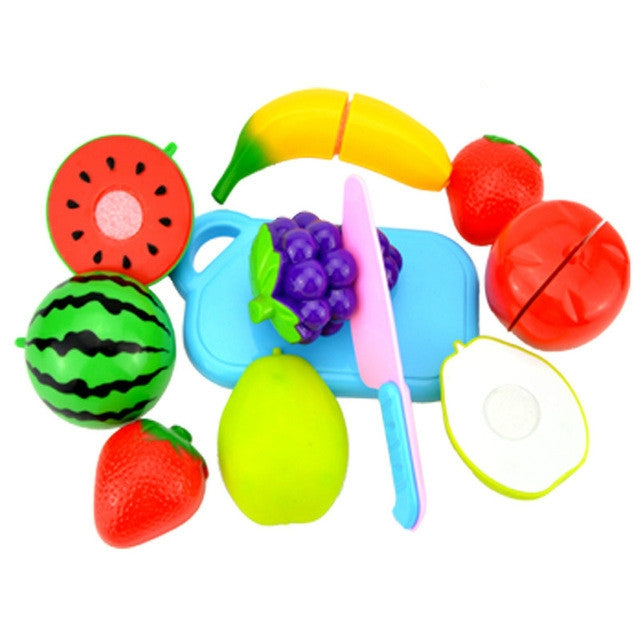 Pretend-play plastic fruit and vegetable cutting toy set with blue tray, knife, and fruit pieces