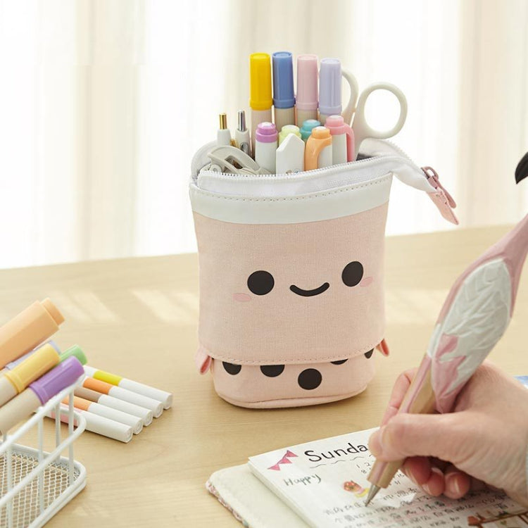 Cream canvas pen holder pouch with cute face, holds colorful markers and pens.
