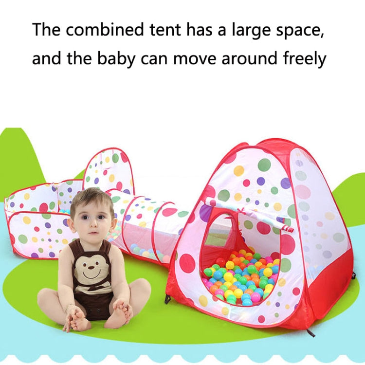 Red children’s play tent and ball pool with tunnel, shown with seated child