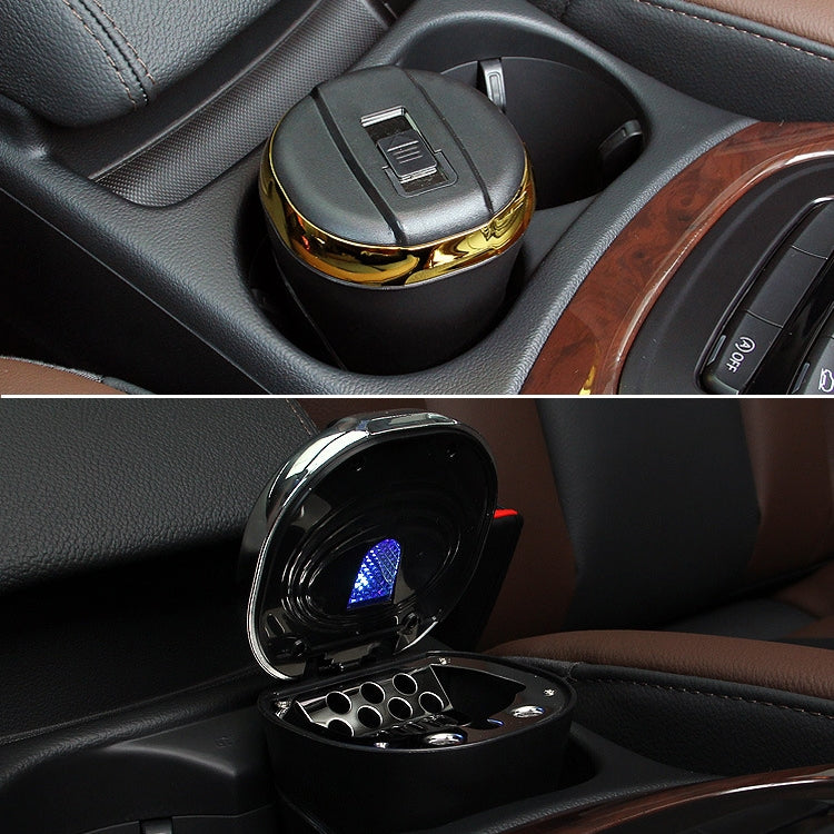 Car ashtray in center console with lid open and LED light on, black with gold top trim