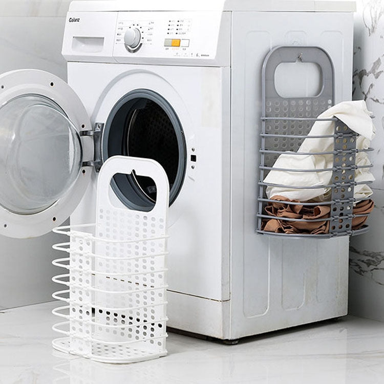 White perforated folding laundry basket with handle; grey wall basket nearby