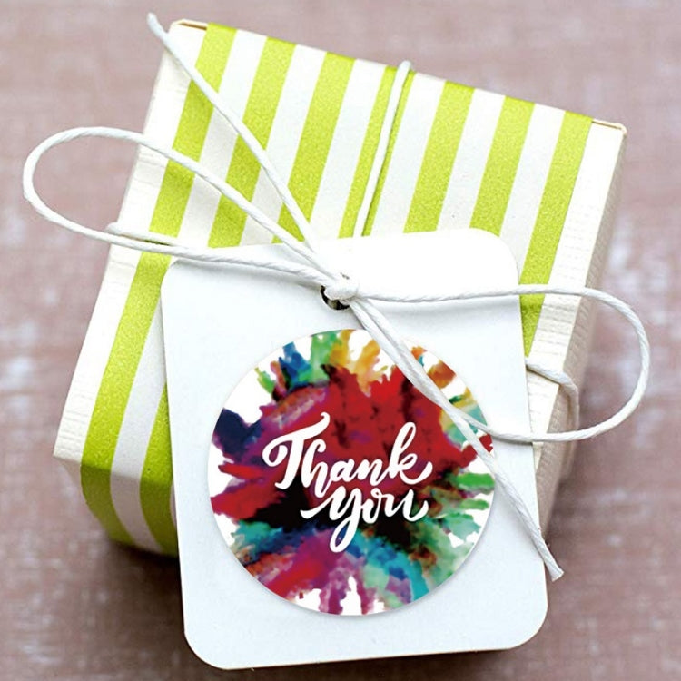Round Thank you sticker seal with watercolor splatter, on striped gift pouch