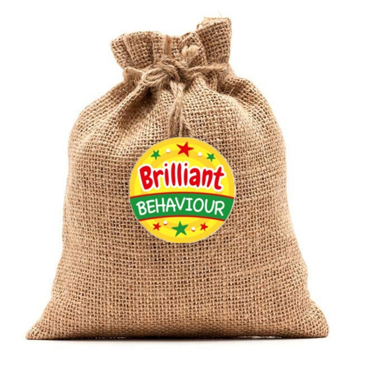 Burlap gift bag with a single round “Brilliant Behaviour” award sticker