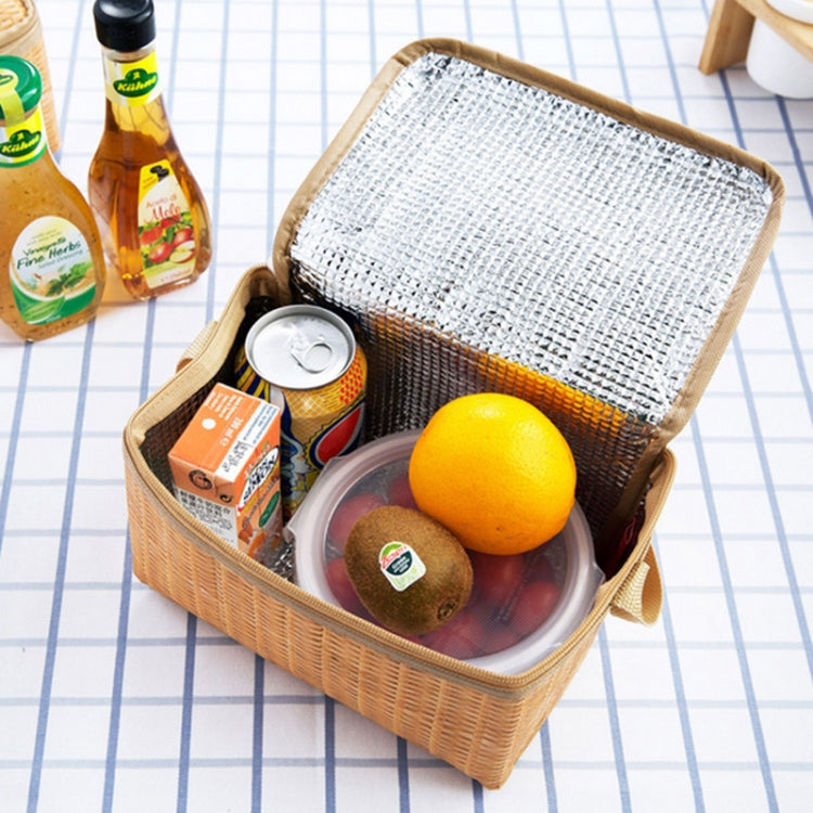 Open insulated lunch bag with silver lid lining; holds fruit, snacks, and cans.