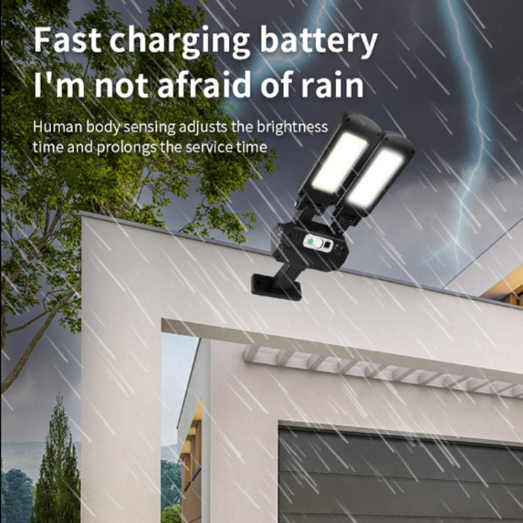 Two-head solar wall light mounted near a doorway, bright light in rain