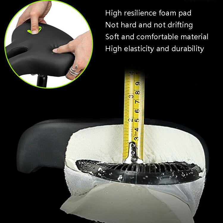 Black bike saddle with thick foam padding shown compressing under pressure