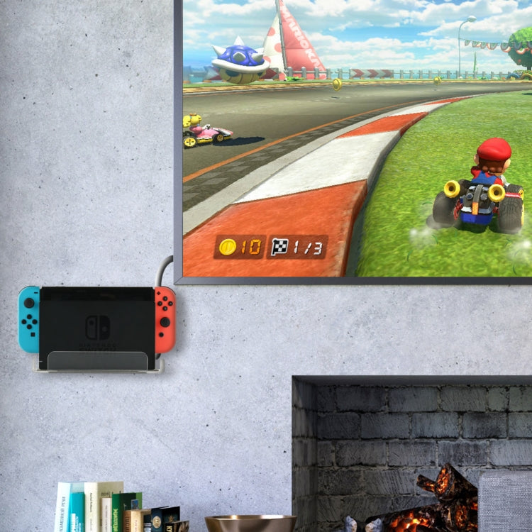 Nintendo Switch console displayed on a transparent wall storage bracket