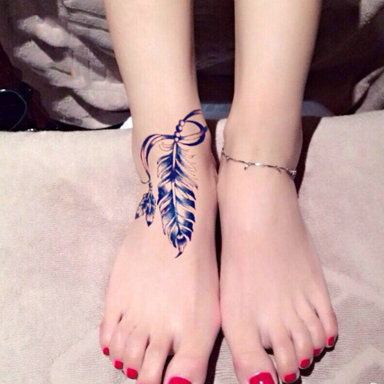 Matching blue feather ankle tattoos on both feet