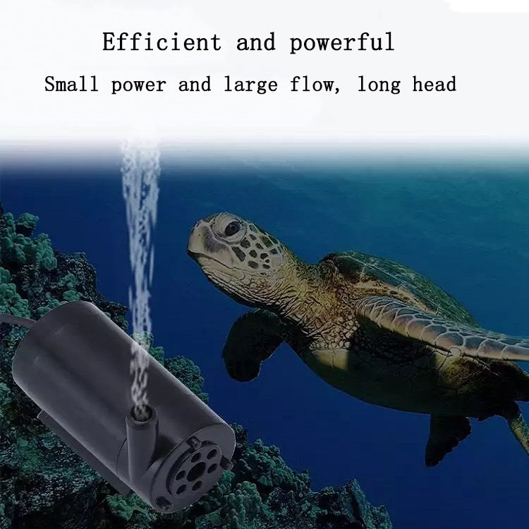 Black mini submersible pump near aquarium floor with water flow stream
