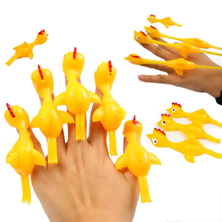 Hand filled with multiple yellow turkey finger toys, stretched outward on fingers