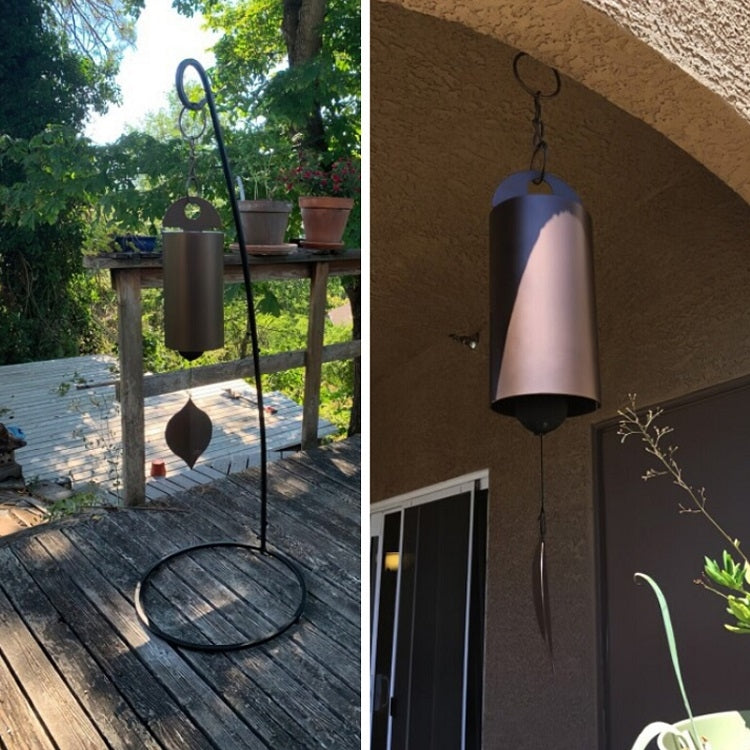 Bronze metal wind chime with bell-like top and hanging leaf clapper