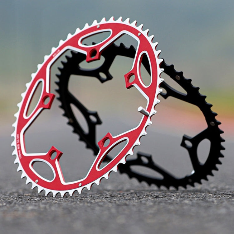 Red and black double chainring set with toothed sprockets and spider design