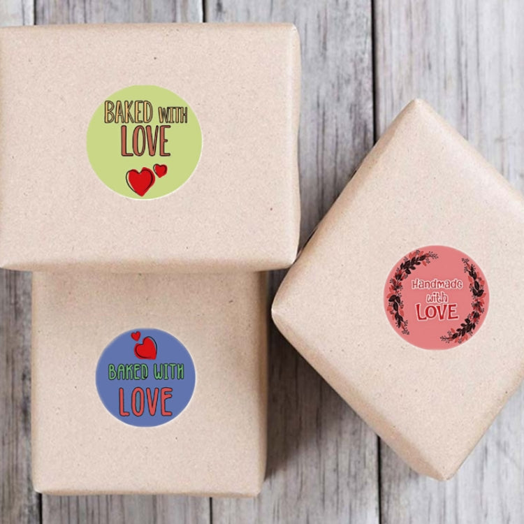 Round kraft paper stickers reading “Baked with LOVE” on kraft gift boxes
