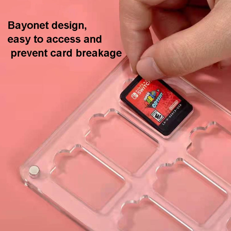 Clear magnetic game card storage box with bayonet-style compartments and a hand inserting a card