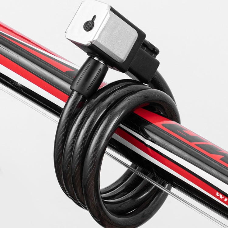 Black cable lock securing a mountain bike frame with coiled loop