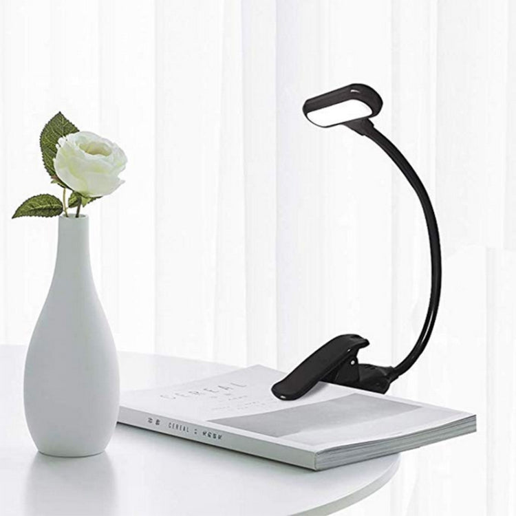 Black mini LED book clip reading lamp with curved neck and clip stand