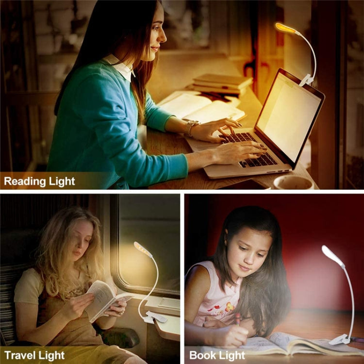 LED reading book clip light in use on desk, warm glow