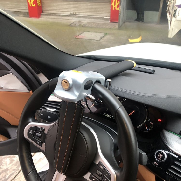 Steering wheel anti-theft lock installed on car steering wheel, black and silver