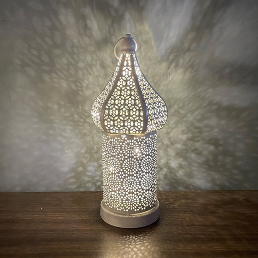 Moroccan hollow LED decorative lamp with cutout pattern and metal base, warm glow