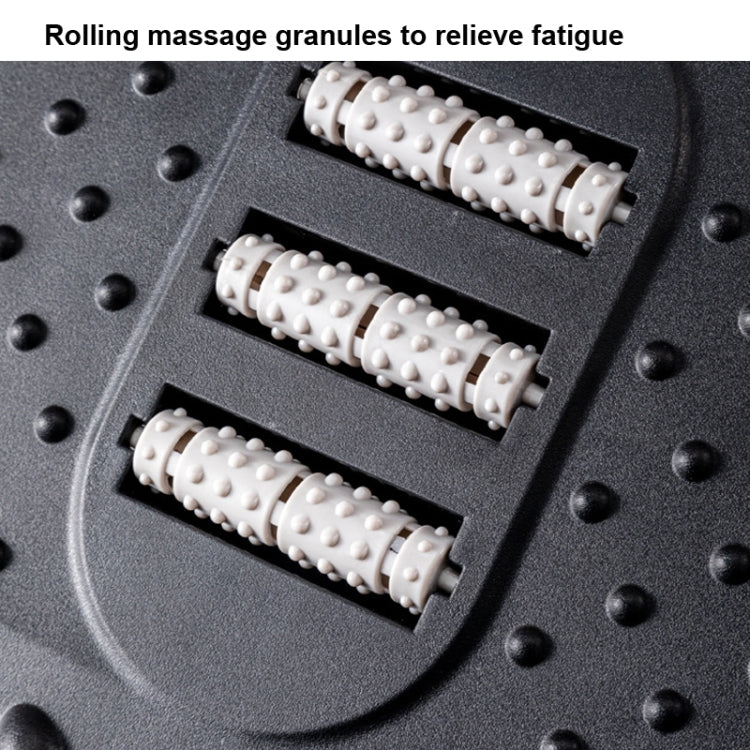 Close-up of white rolling massage granules on dark foot massage step stool surface