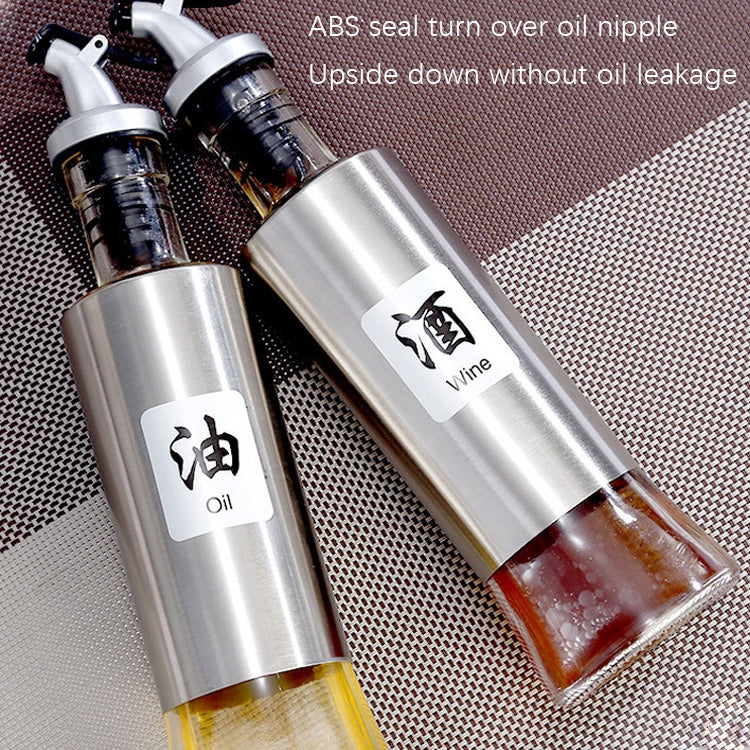 Stainless steel oil bottle set with pump spout and glass reservoir, oil bottles shown