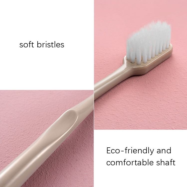 Nano toothbrush with soft white bristles on a beige handle, side angle