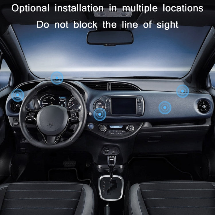 Black magnetic phone holder mounted on car dashboard near controls