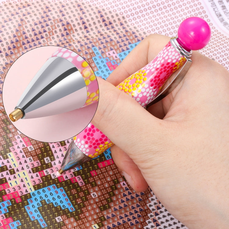 Diamond painting drill pen with pink ball top and multicolor dotted handle, single tip