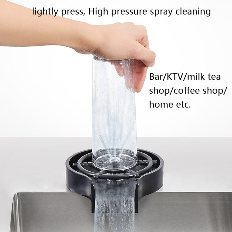 Faucet sprayer washer in use, high-pressure water stream from nozzle head