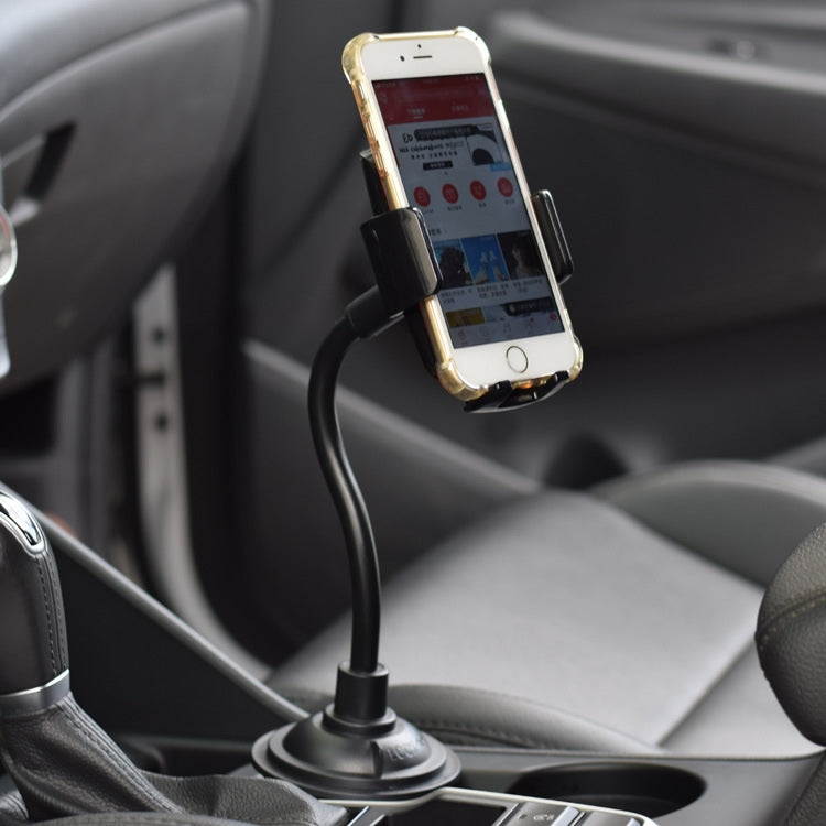 Car phone holder on console with suction base, long hose, and smartphone cradle, black.
