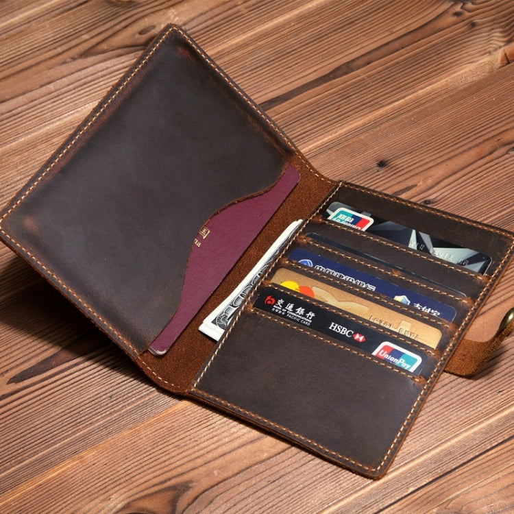 Vintage leather passport card holder open with card slots holding several cards