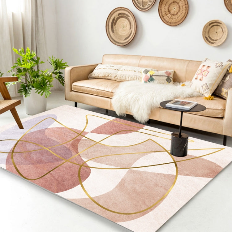 Geometric area rug with pink and cream shapes and thin yellow circle line design