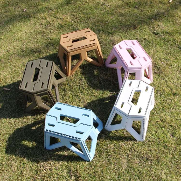 Assorted folding plastic stools in tan, pink, white, and blue