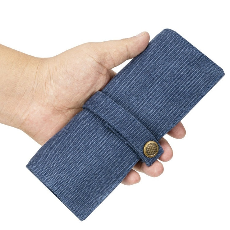 Blue nylon canvas watch strap storage bag, folded wrap with snap button closure.