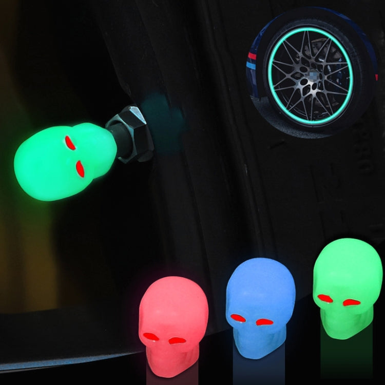 Luminous skull tire valve caps glow on wheel valves: green, blue, and red shown.