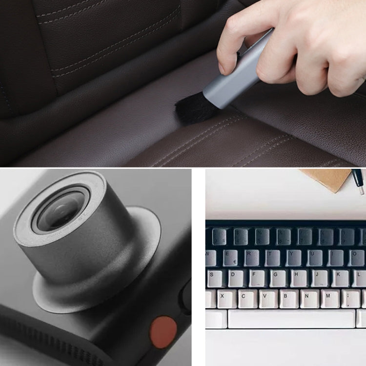 Telescopic car cleaning brush with bristle head, shown being used on car interior
