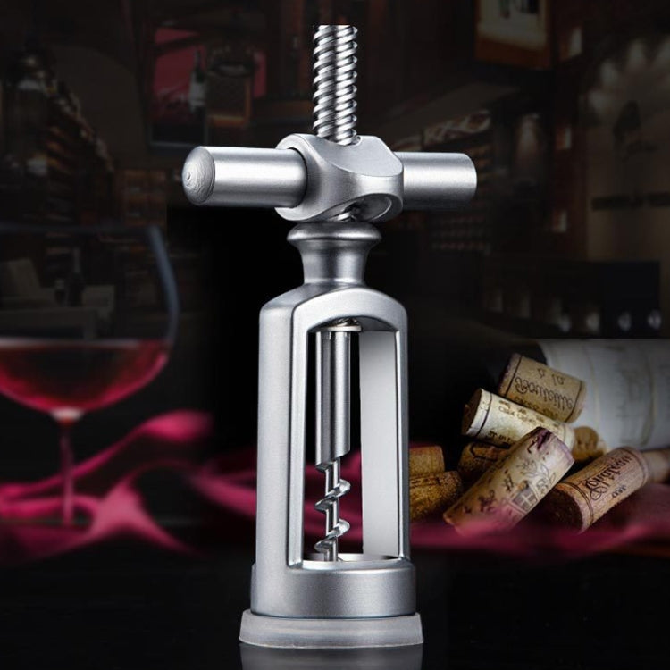 Wine bottle auger opener with silver metal body, vertical screw, and horizontal crossbar handle
