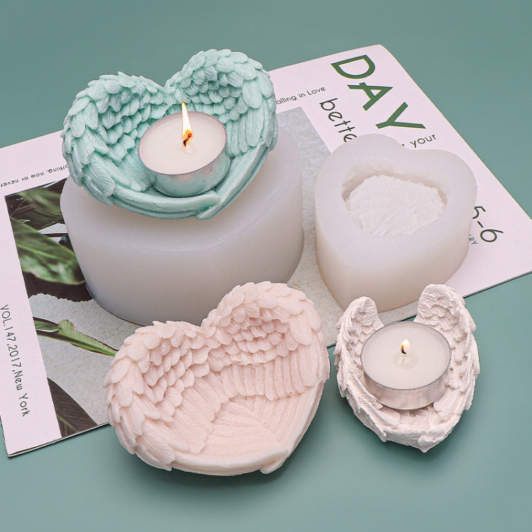 Heart-shaped angel wings silicone mold with candles in heart cavities and wing details